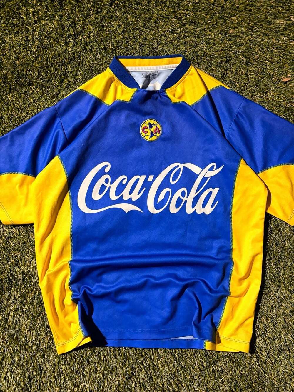 Club America Blue and Yellow Soccer Jersey with Coca-Cola and Corona Branding